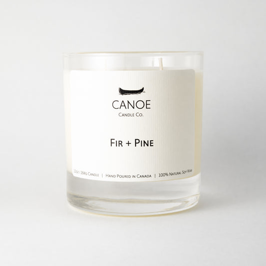 Canoe Candle Co's Fir + Pine 10oz soy wax candle on a plain white background.