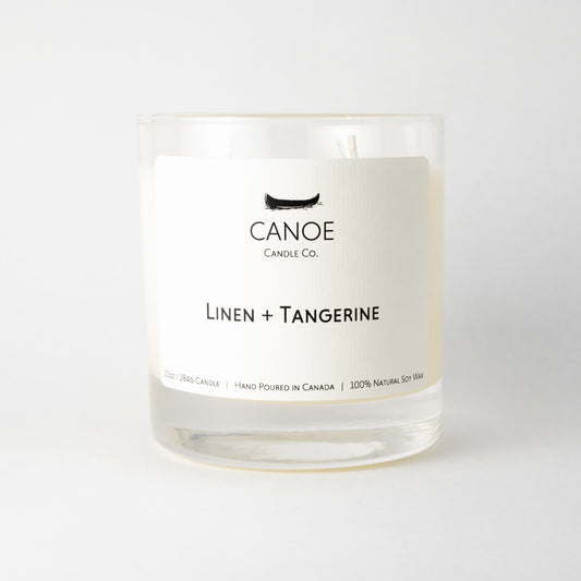 Canoe Candle Co.’s Linen + Tangerine 10oz soy wax candle on a plain white background.